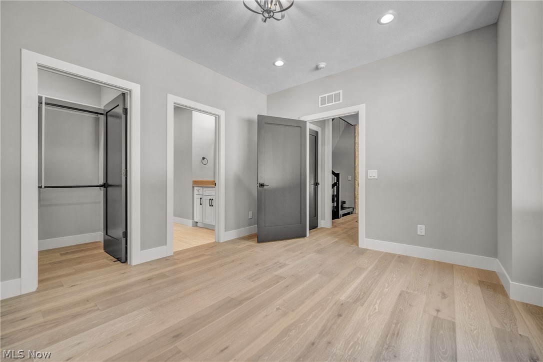 4009 Brainard Road Beachwood, OH 44122 - Photo 36 of 50 bedroom featuring light hardwood flooring and ensuite bathroom