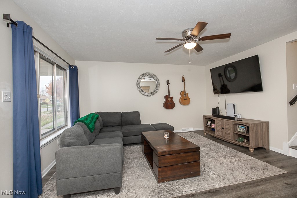 4357 Valleyside Road Cleveland, OH 44135 - Photo 3 of 26 Living room featuring wood-type flooring, a textured ceiling, and ceiling fan