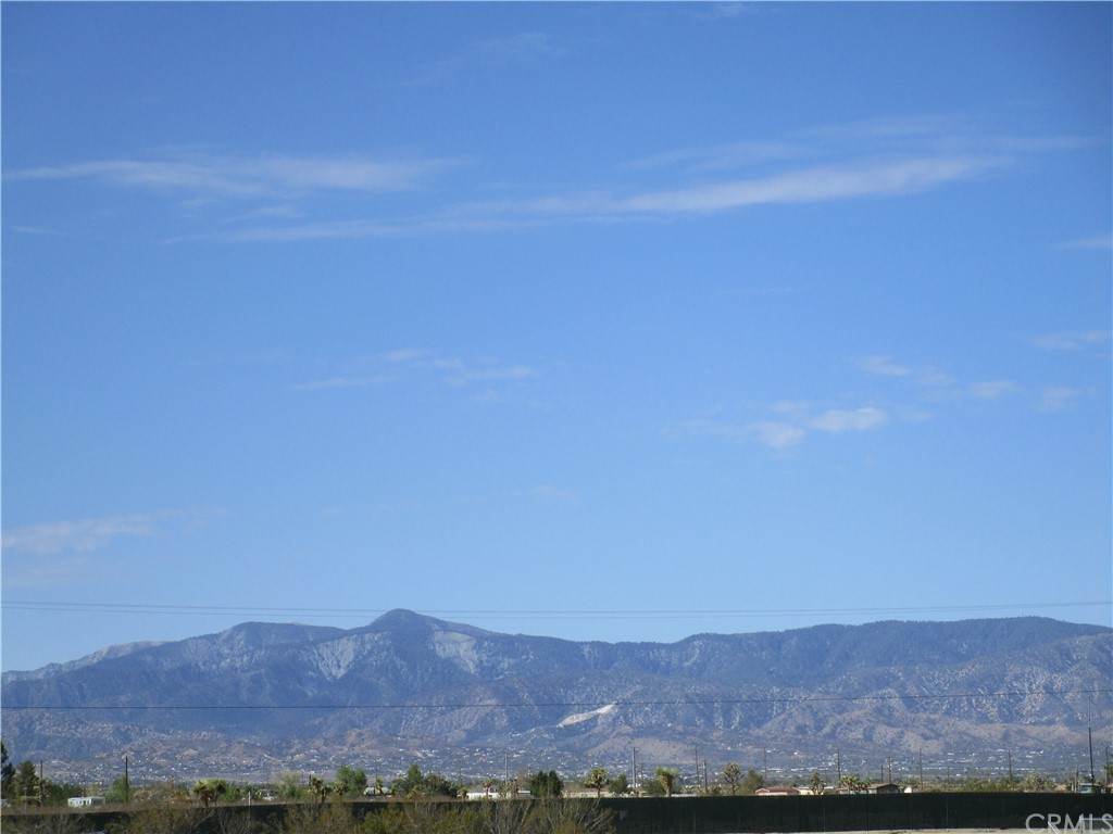 13748 Paramount Road, Unit 179 Phelan, CA 92371 - Photo 1 of 1 a view of a large mountain with mountains in the background