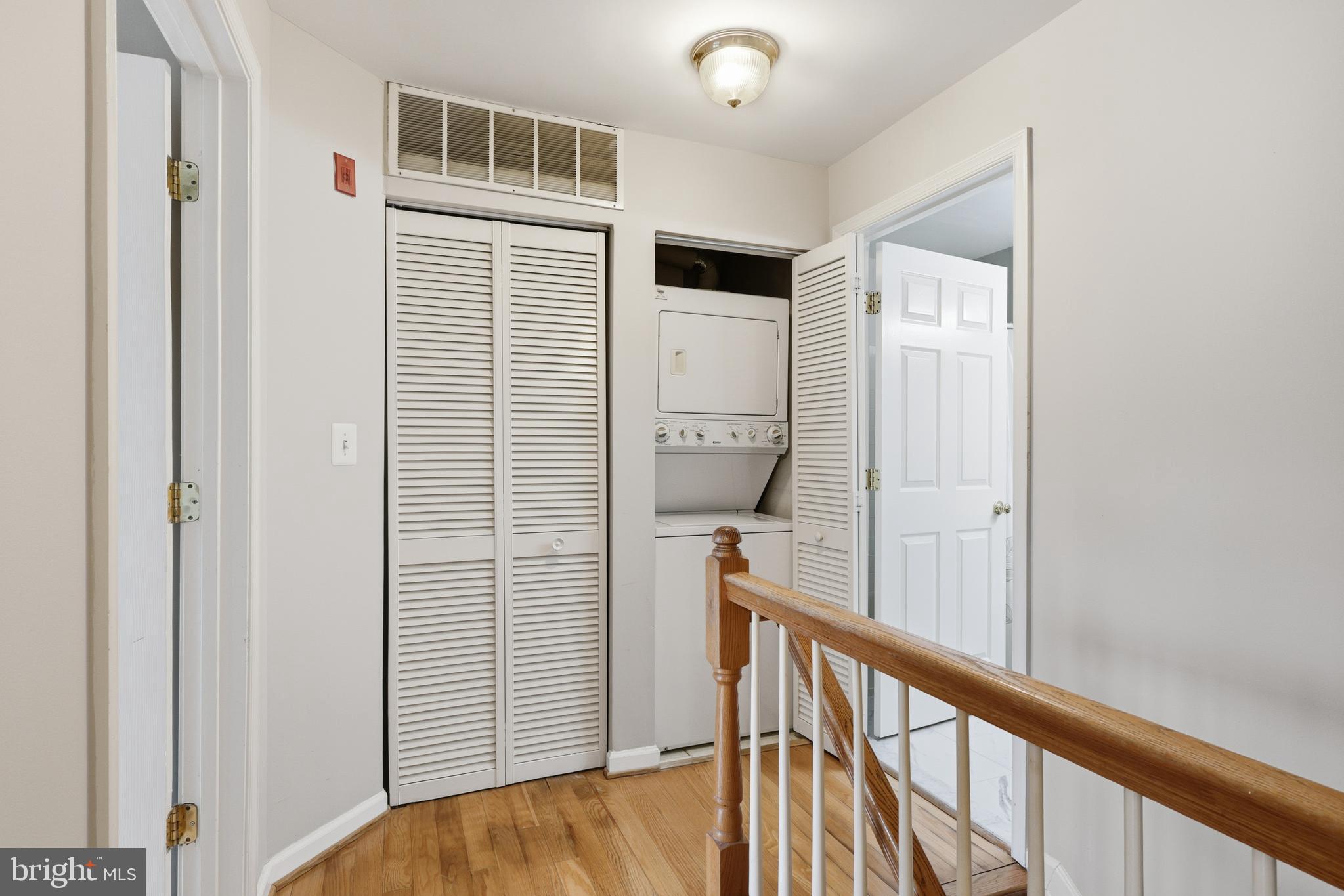 1934 Crescent Park Drive, Unit 28A Reston, VA 20190 - Photo 13 of 38 a view of a hallway with wooden floor and entryway