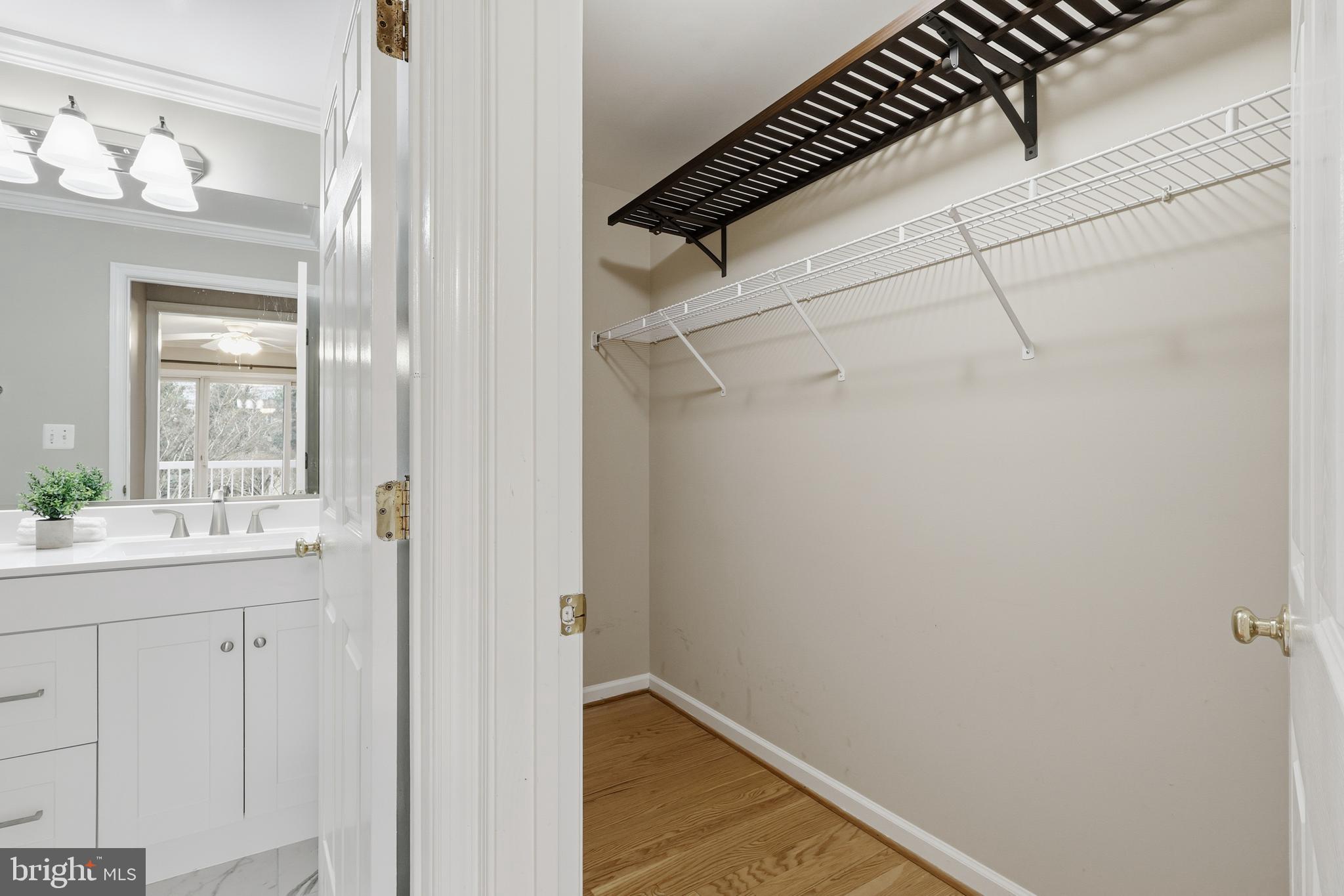 1934 Crescent Park Drive, Unit 28A Reston, VA 20190 - Photo 18 of 38 a bathroom with a sink and mirror