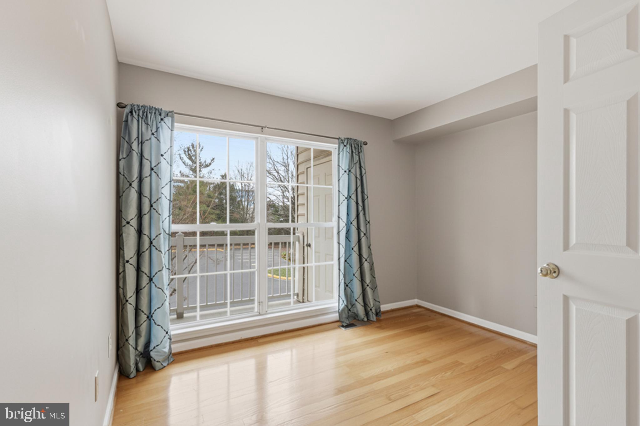 1934 Crescent Park Drive, Unit 28A Reston, VA 20190 - Photo 20 of 38 a view of empty room with wooden floor and fan