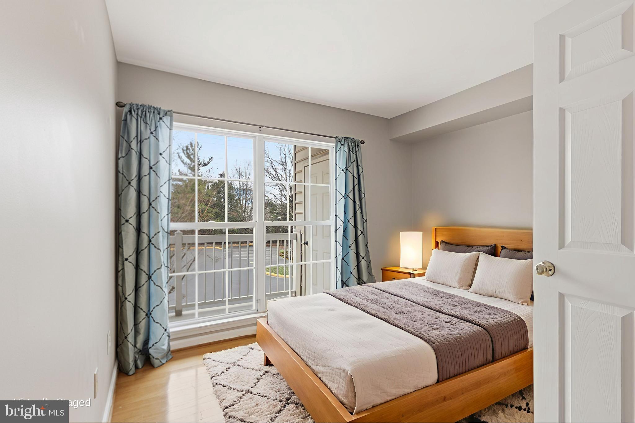 1934 Crescent Park Drive, Unit 28A Reston, VA 20190 - Photo 21 of 38 a bedroom with a large bed and a window