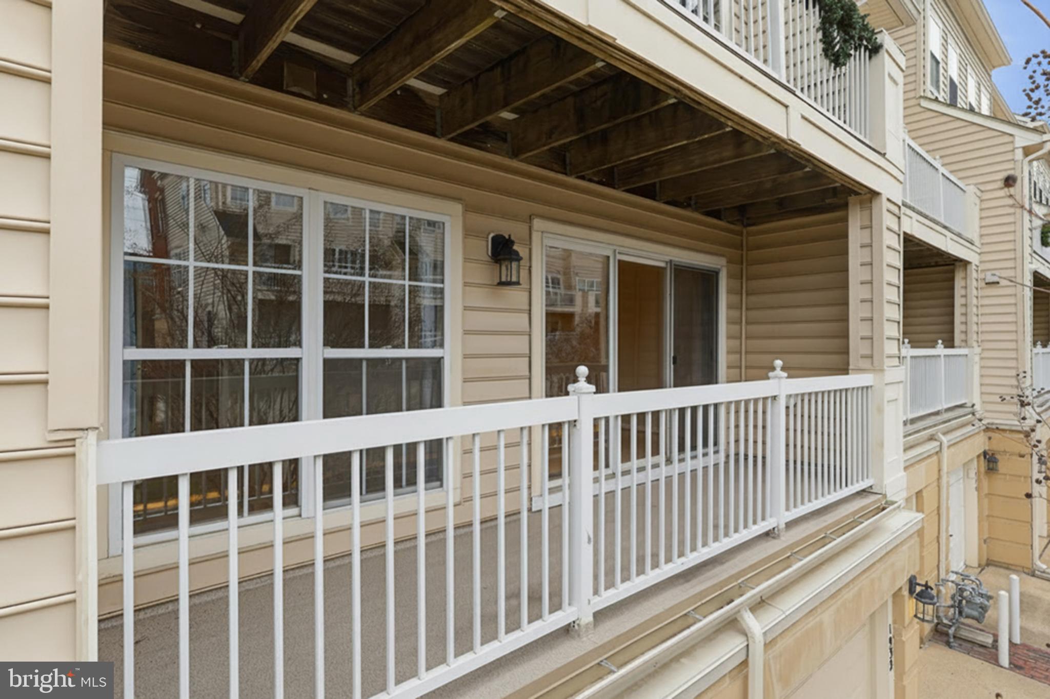 1934 Crescent Park Drive, Unit 28A Reston, VA 20190 - Photo 24 of 38 a view of a balcony with a large window