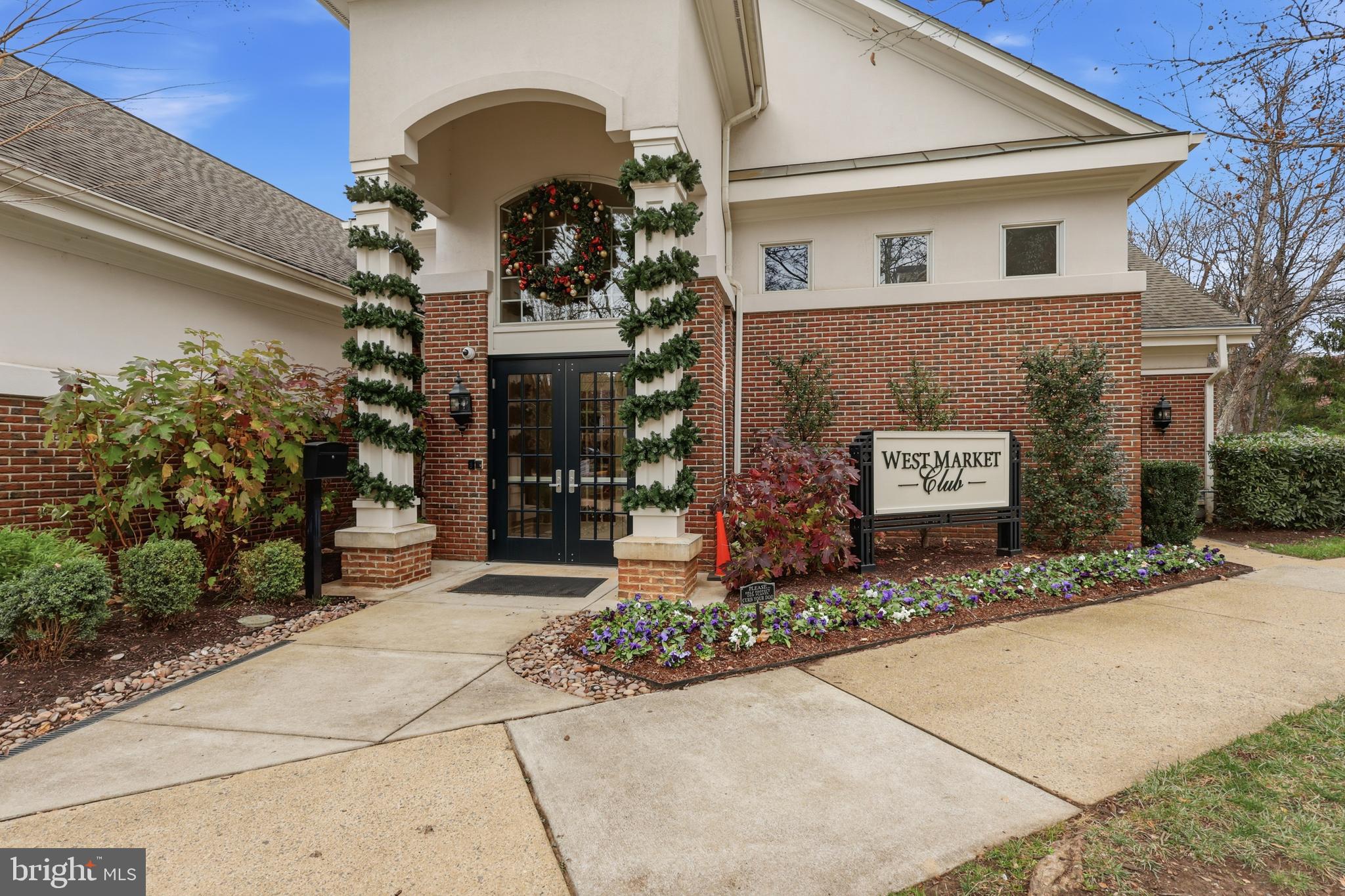 1934 Crescent Park Drive, Unit 28A Reston, VA 20190 - Photo 26 of 38 a front view of a house with garden