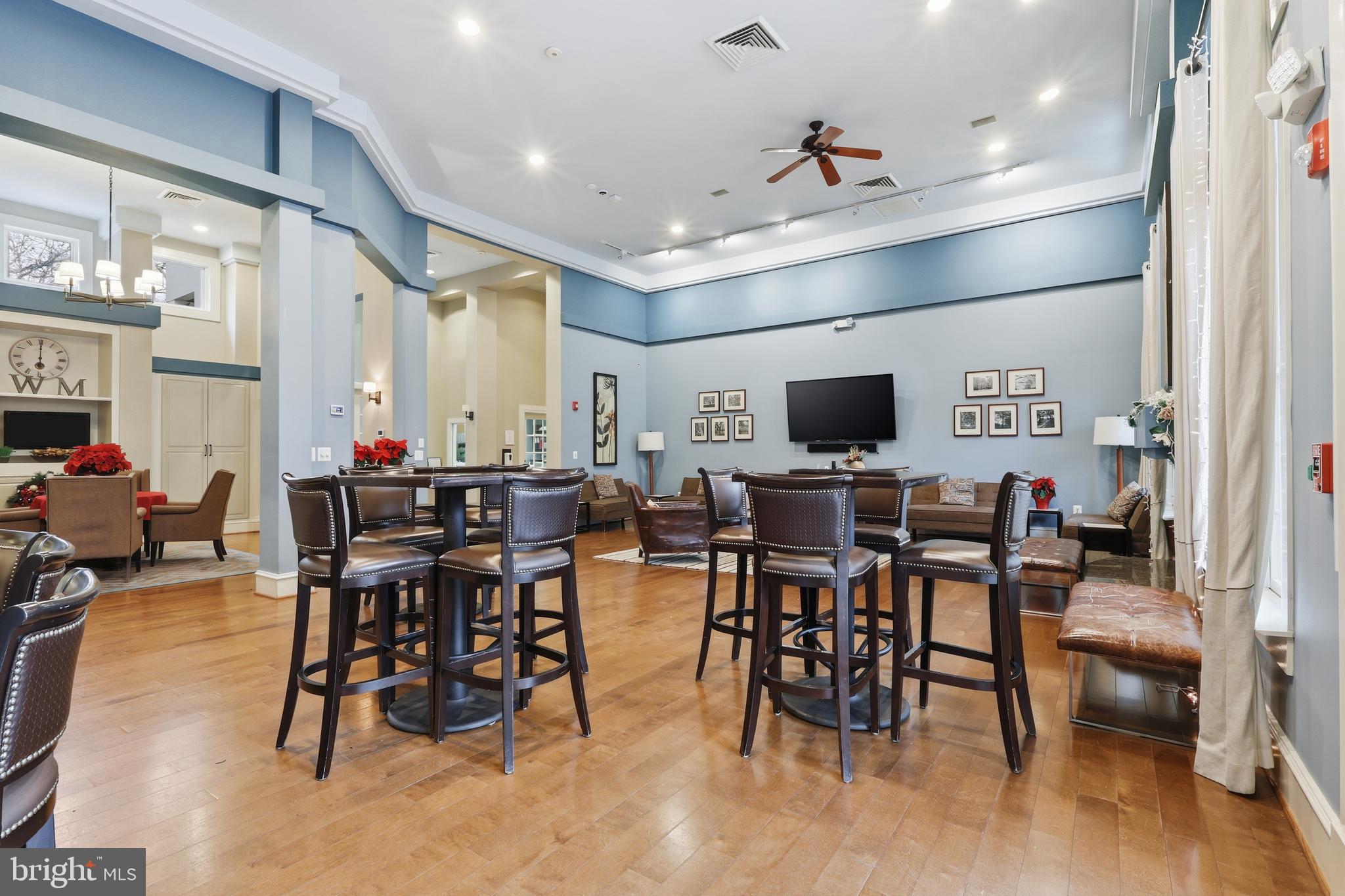 1934 Crescent Park Drive, Unit 28A Reston, VA 20190 - Photo 30 of 38 a view of a dining room with furniture and wooden floor