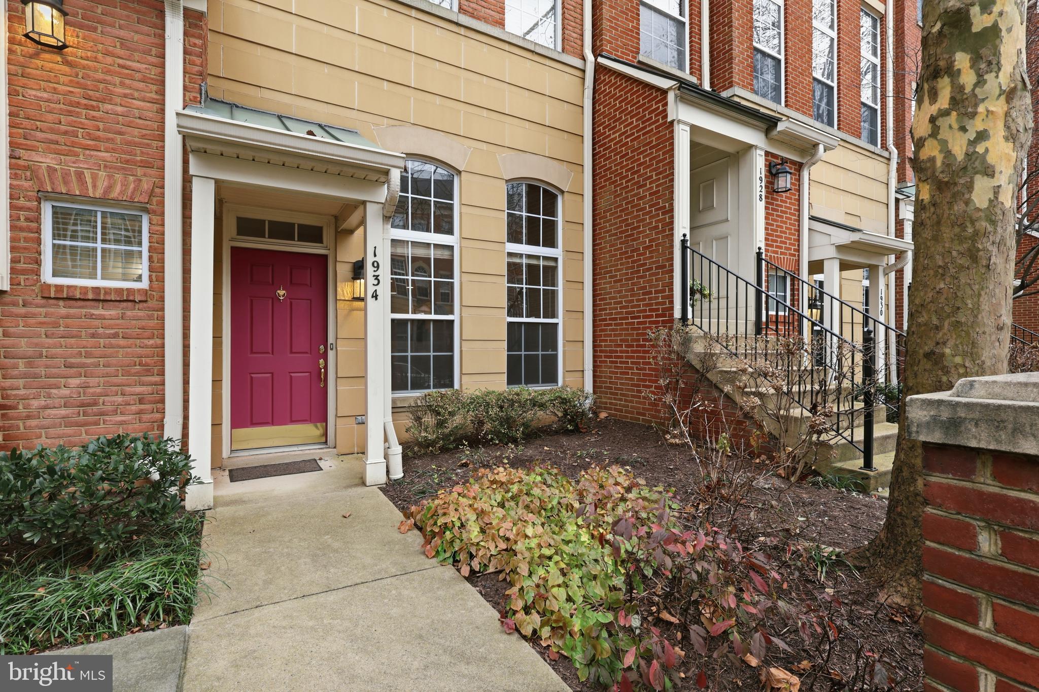 1934 Crescent Park Drive, Unit 28A Reston, VA 20190 - Photo 4 of 38 a front view of a house with a yard