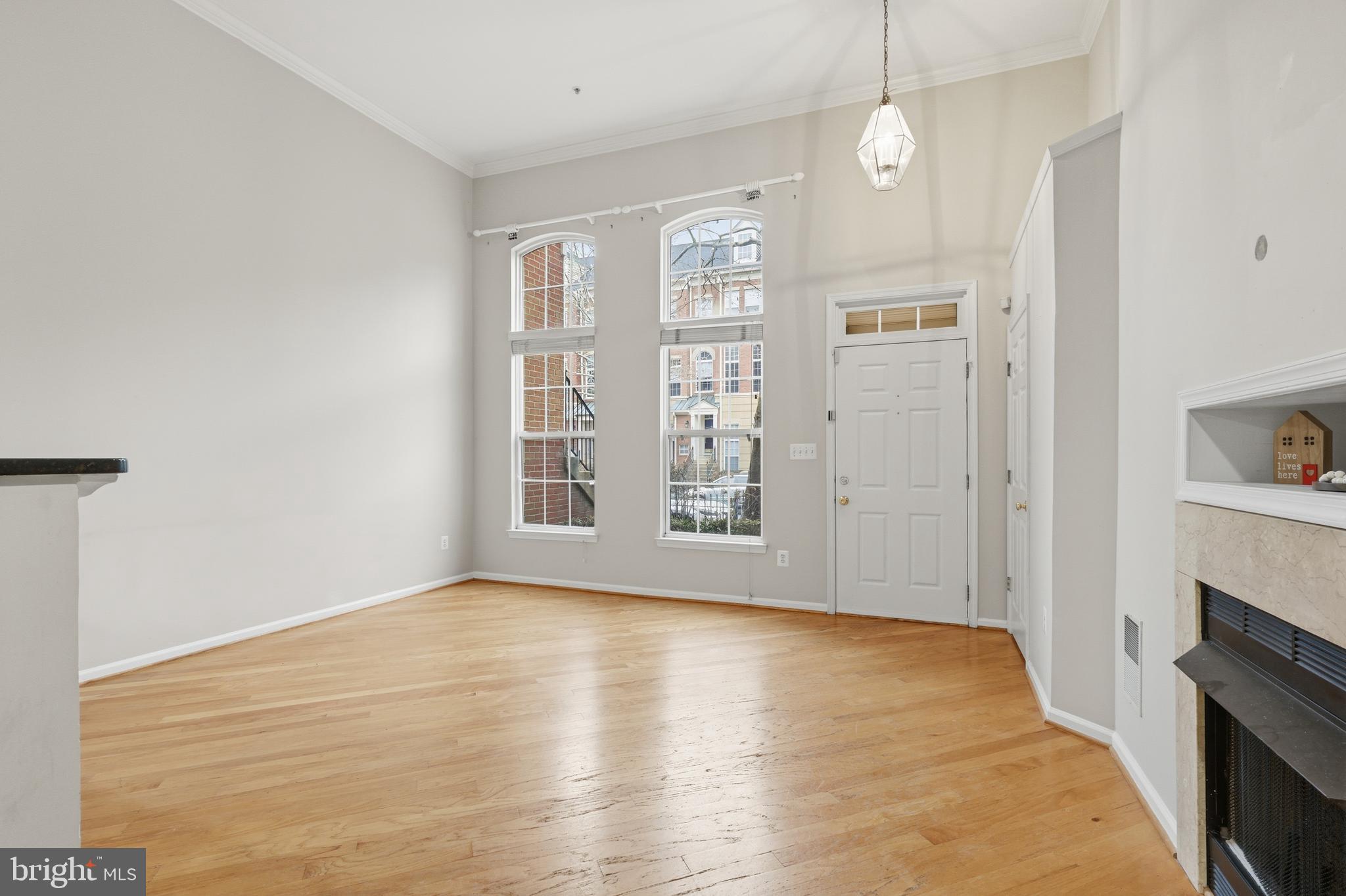 1934 Crescent Park Drive, Unit 28A Reston, VA 20190 - Photo 6 of 38 a view of livingroom with hardwood floor and a ceiling fan
