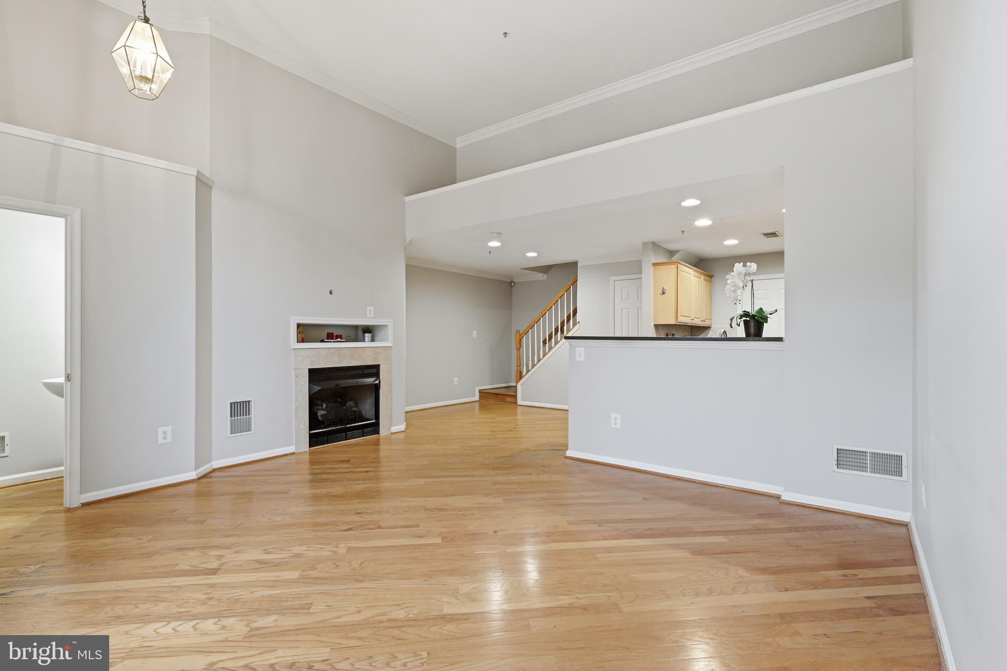 1934 Crescent Park Drive, Unit 28A Reston, VA 20190 - Photo 7 of 38 a view of a kitchen with a sink and a fireplace