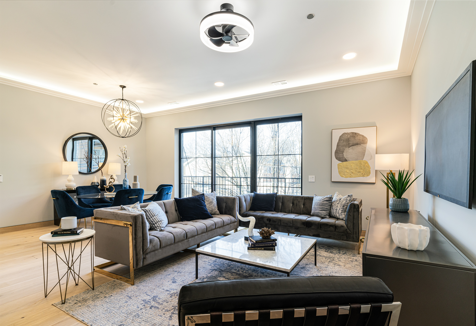 2024 West Irving Park Road, Unit 304 Chicago, IL 60618 - Photo 6 of 12 a living room with furniture a fireplace and a large window