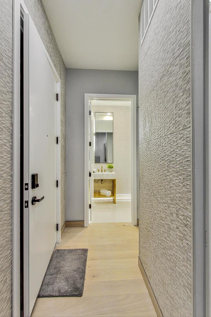 2024 West Irving Park Road, Unit 304 Chicago, IL 60618 - Photo 7 of 12 a view of a bathroom from the hallway