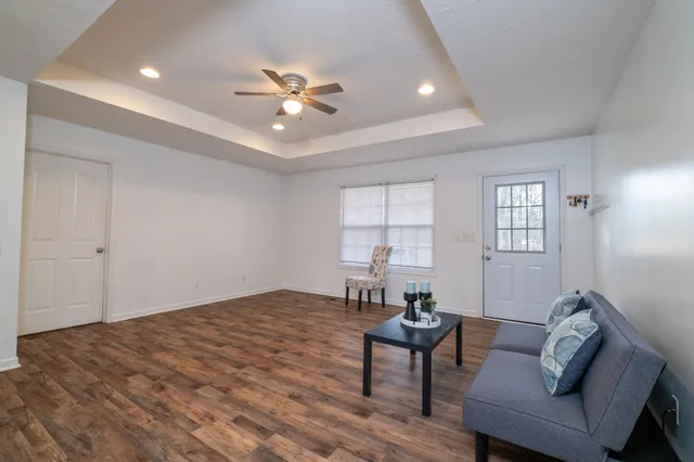a living room with furniture and window