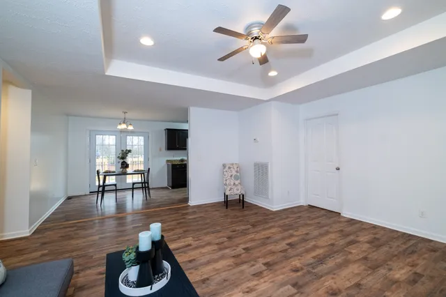 a view of a livingroom with furniture nad wooden floor