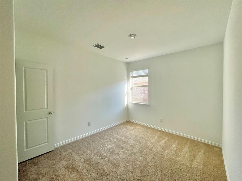 768 Hawthorn Street Princeton, TX 75407 - Photo 11 of 23 a view of an empty room with a window