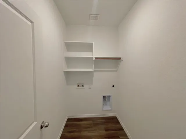 an empty room with windows and ceiling fan view