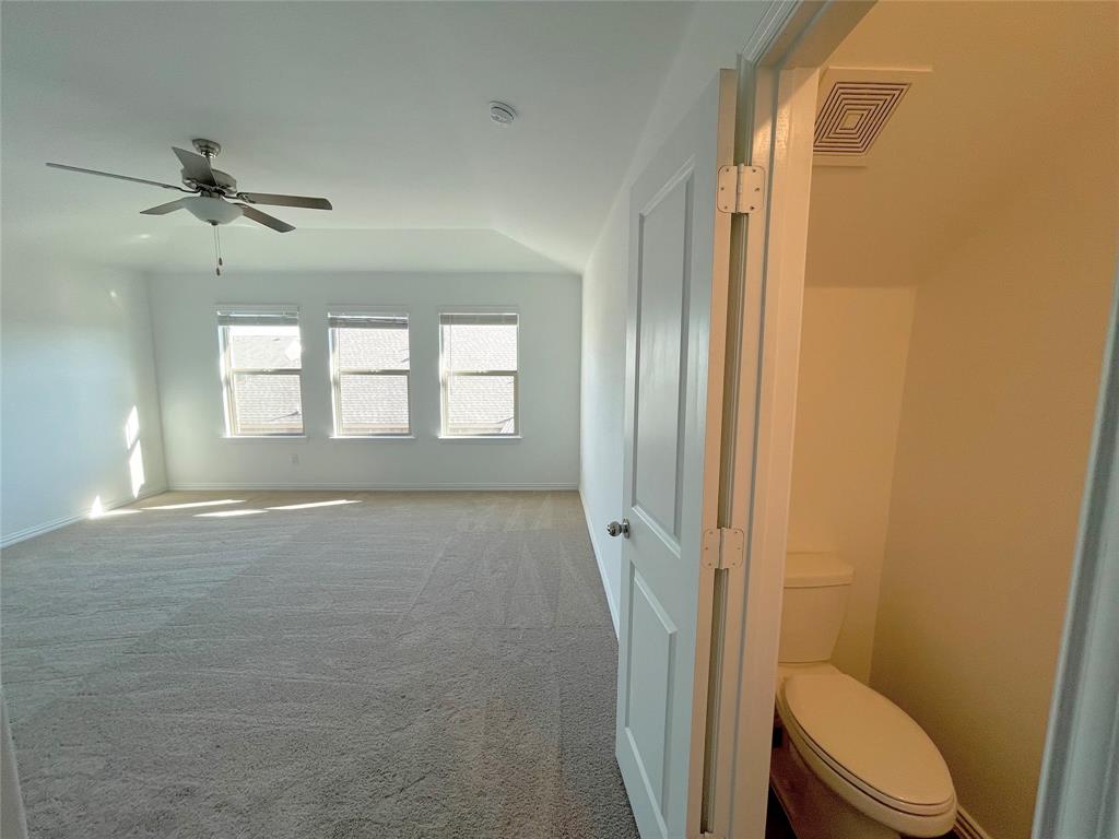 768 Hawthorn Street Princeton, TX 75407 - Photo 18 of 23 a bathroom with a toilet and a shower