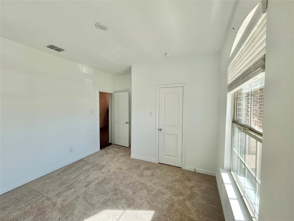 768 Hawthorn Street Princeton, TX 75407 - Photo 7 of 23 a view of an empty room with a window