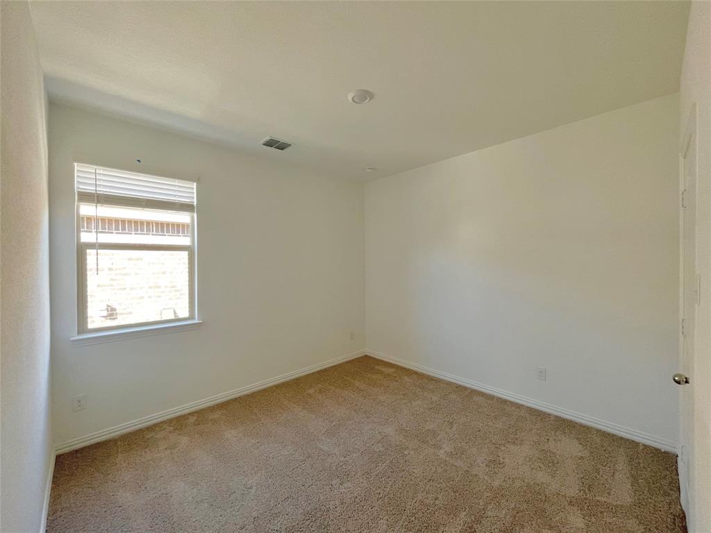 768 Hawthorn Street Princeton, TX 75407 - Photo 8 of 23 an empty room with a window