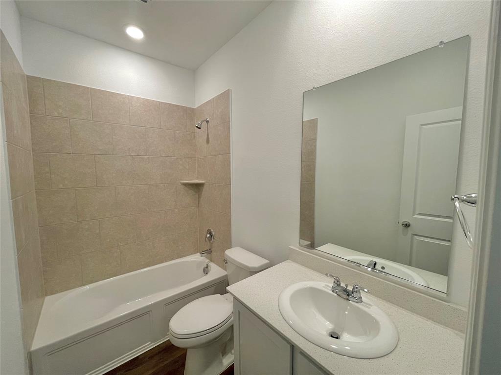 768 Hawthorn Street Princeton, TX 75407 - Photo 10 of 23 a bathroom with a sink toilet and shower