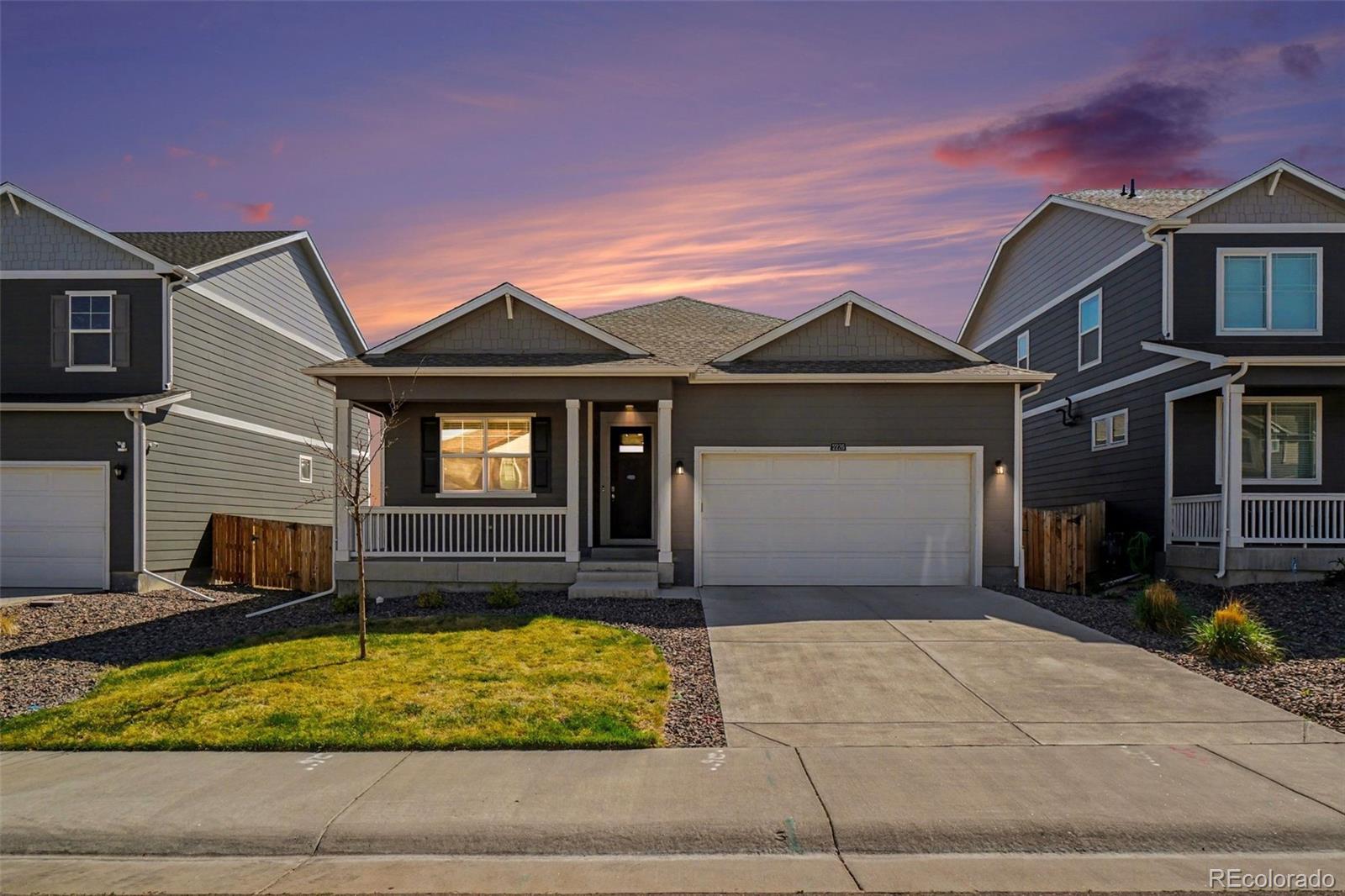 2226 Monte Vista Court Fort Lupton, CO 80621 - Photo 2 of 25 a front view of a house with garden