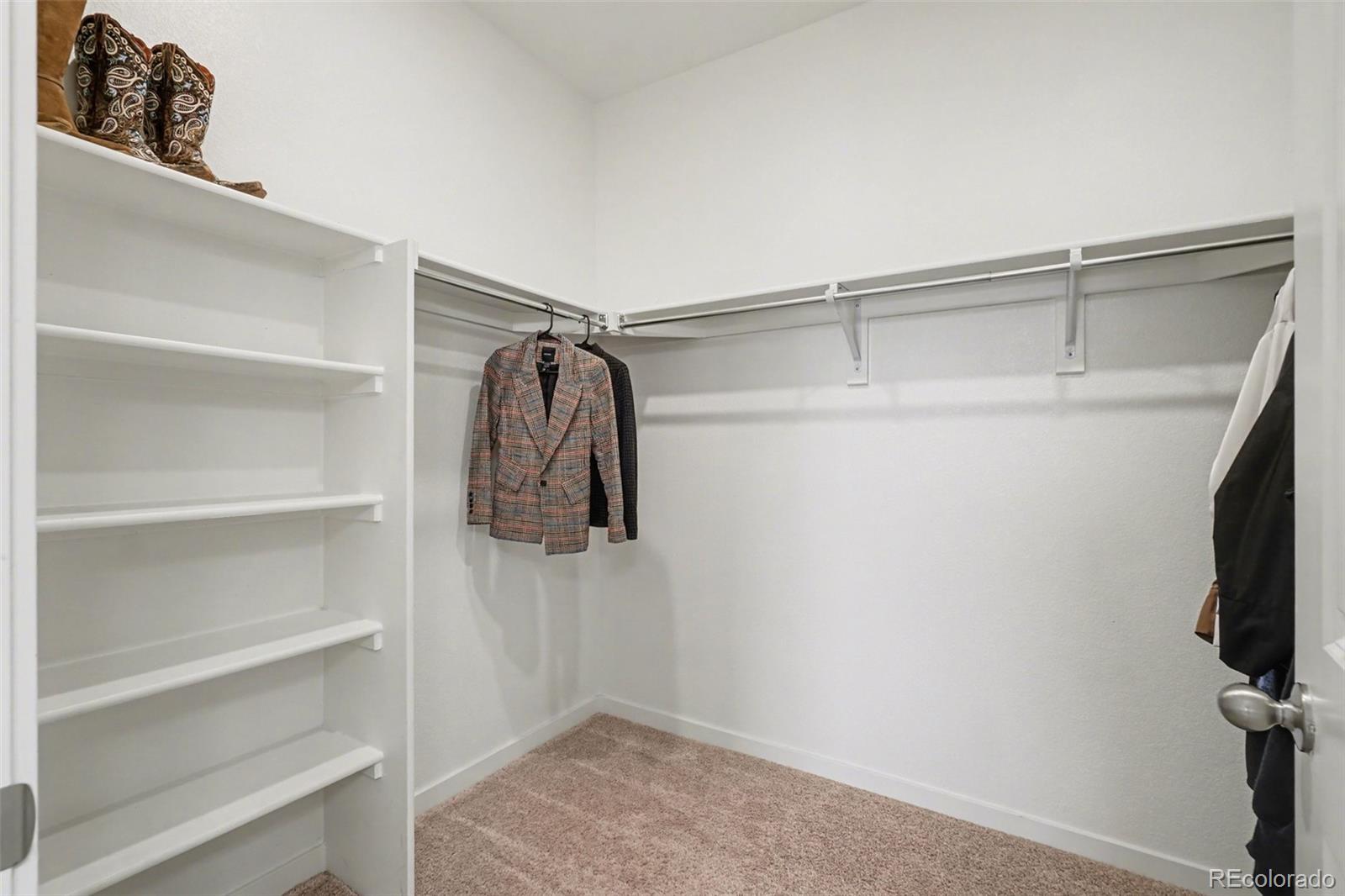 2226 Monte Vista Court Fort Lupton, CO 80621 - Photo 21 of 25 a view of walk in closet with empty racks