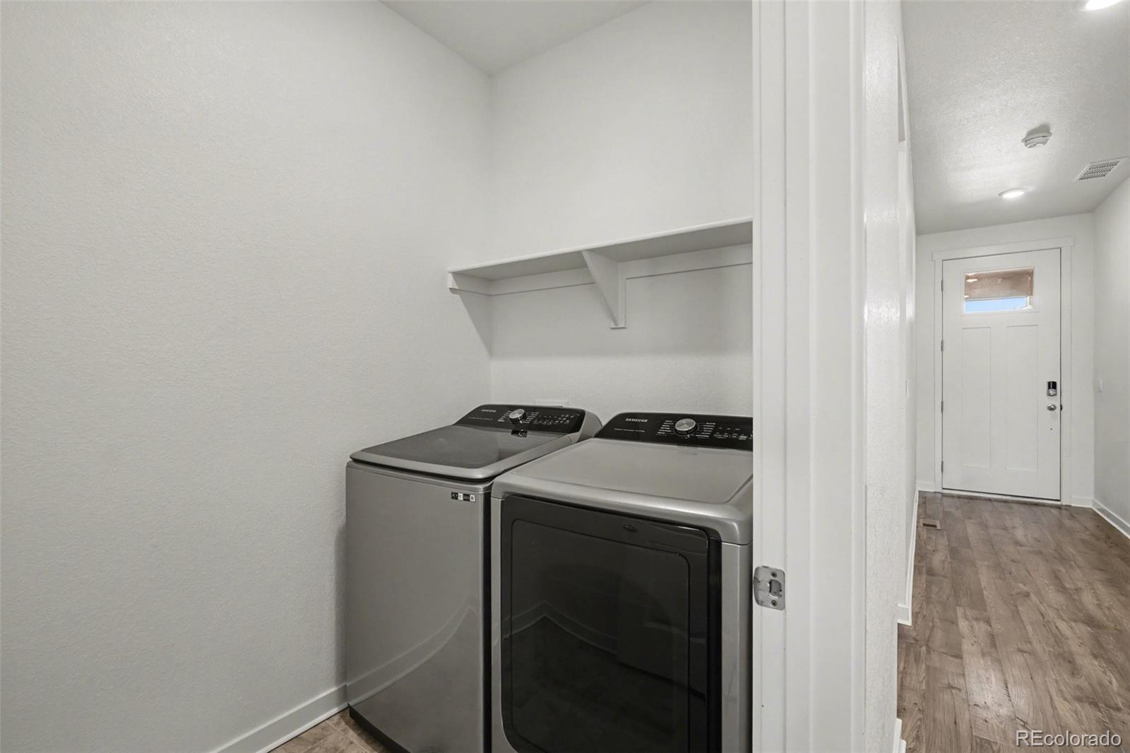 2226 Monte Vista Court Fort Lupton, CO 80621 - Photo 22 of 25 a utility room with dryer and washer