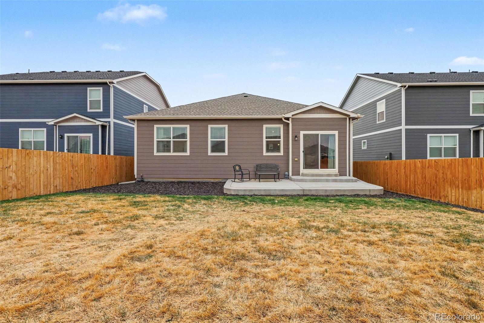 2226 Monte Vista Court Fort Lupton, CO 80621 - Photo 23 of 25 a front view of a house with garden