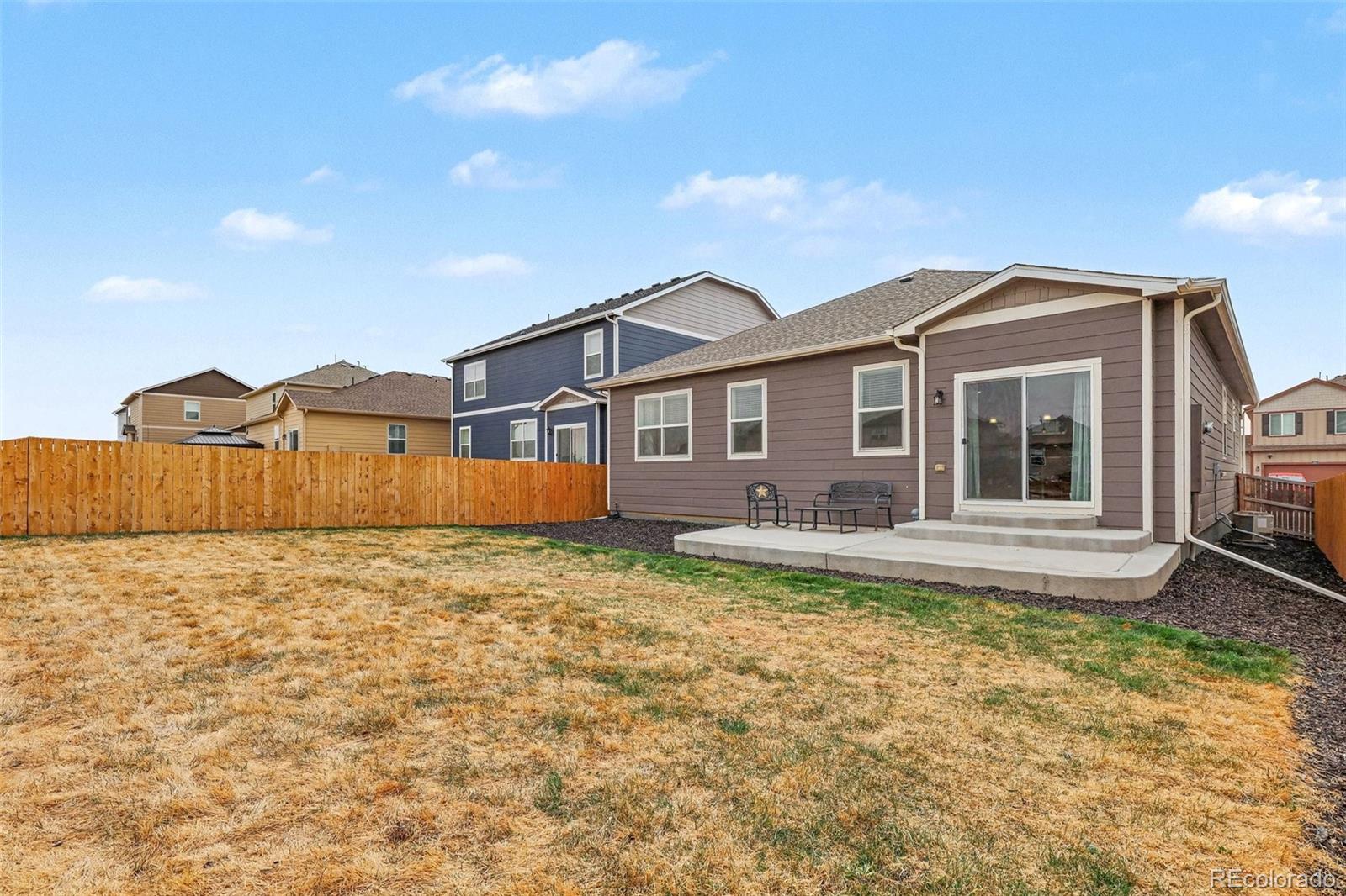 2226 Monte Vista Court Fort Lupton, CO 80621 - Photo 24 of 25 a front view of a house with garden