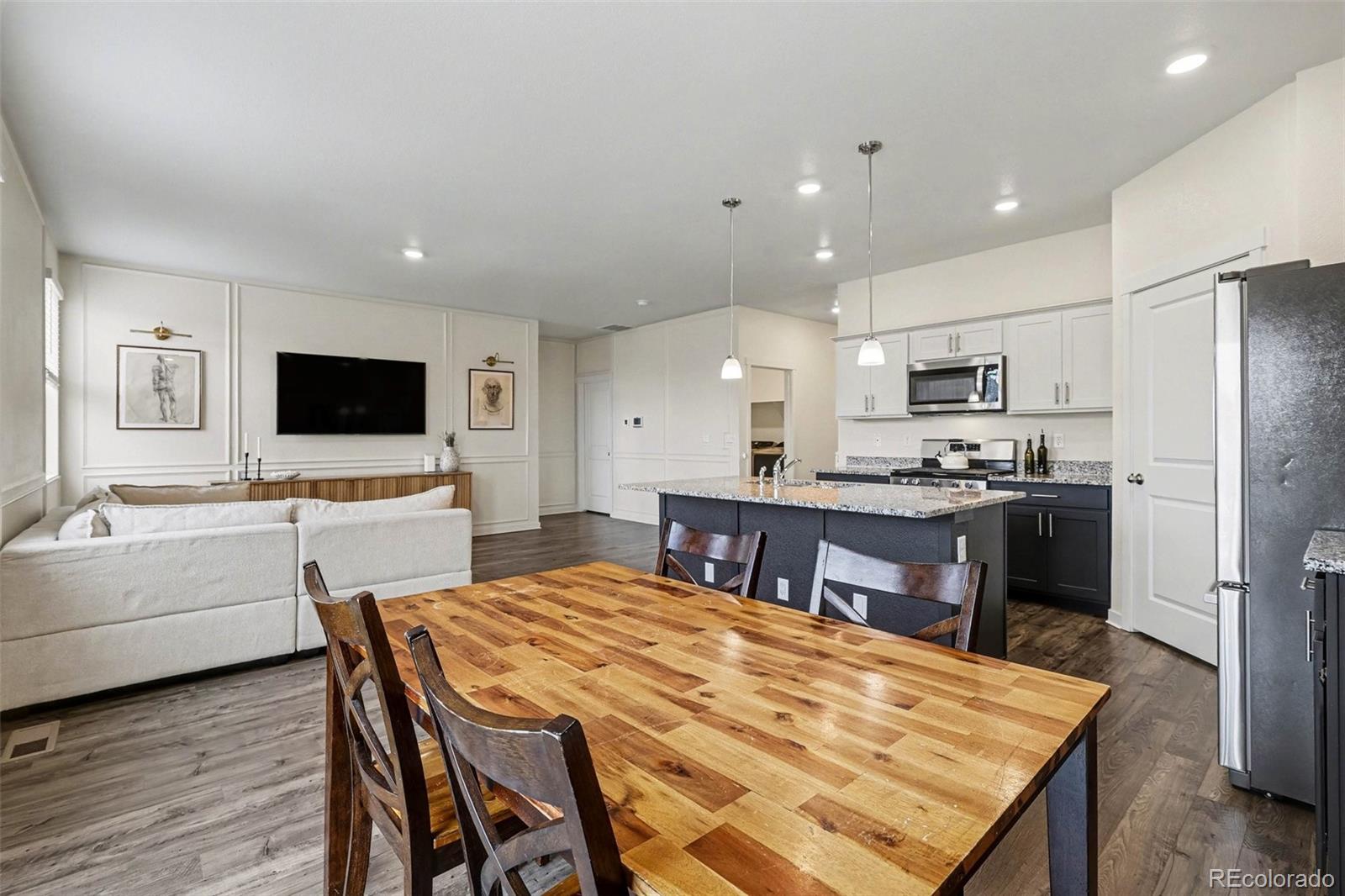 2226 Monte Vista Court Fort Lupton, CO 80621 - Photo 7 of 25 a large kitchen with a table and chairs