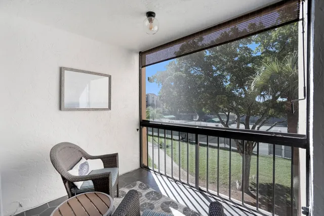 a view of a swimming pool with a patio and a garden