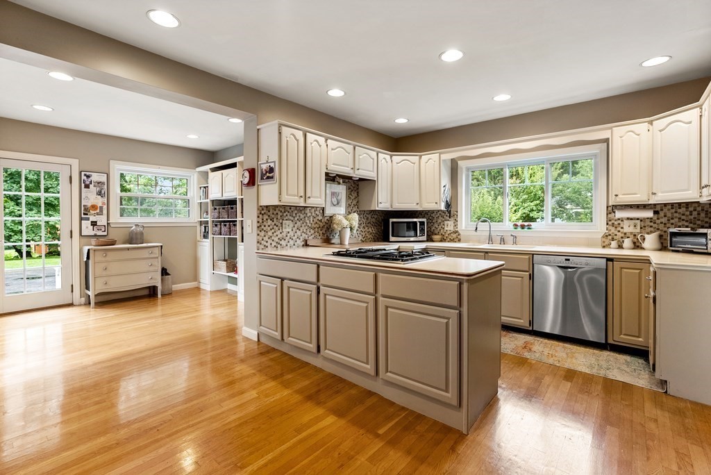 126 Chapman Street Canton, MA 02021 - Photo 16 of 42 a kitchen with a sink window and cabinets