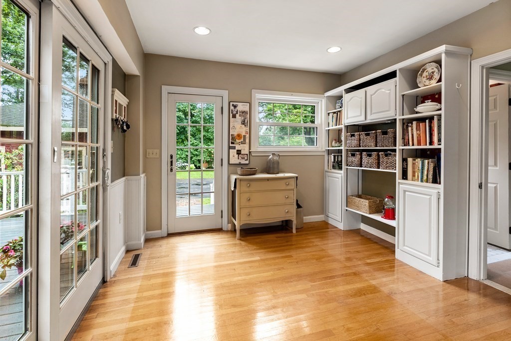 126 Chapman Street Canton, MA 02021 - Photo 19 of 42 a living room with furniture and a book shelf
