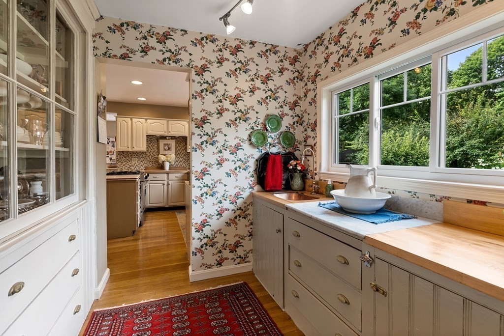 126 Chapman Street Canton, MA 02021 - Photo 20 of 42 a kitchen with sink cabinets and refrigerator