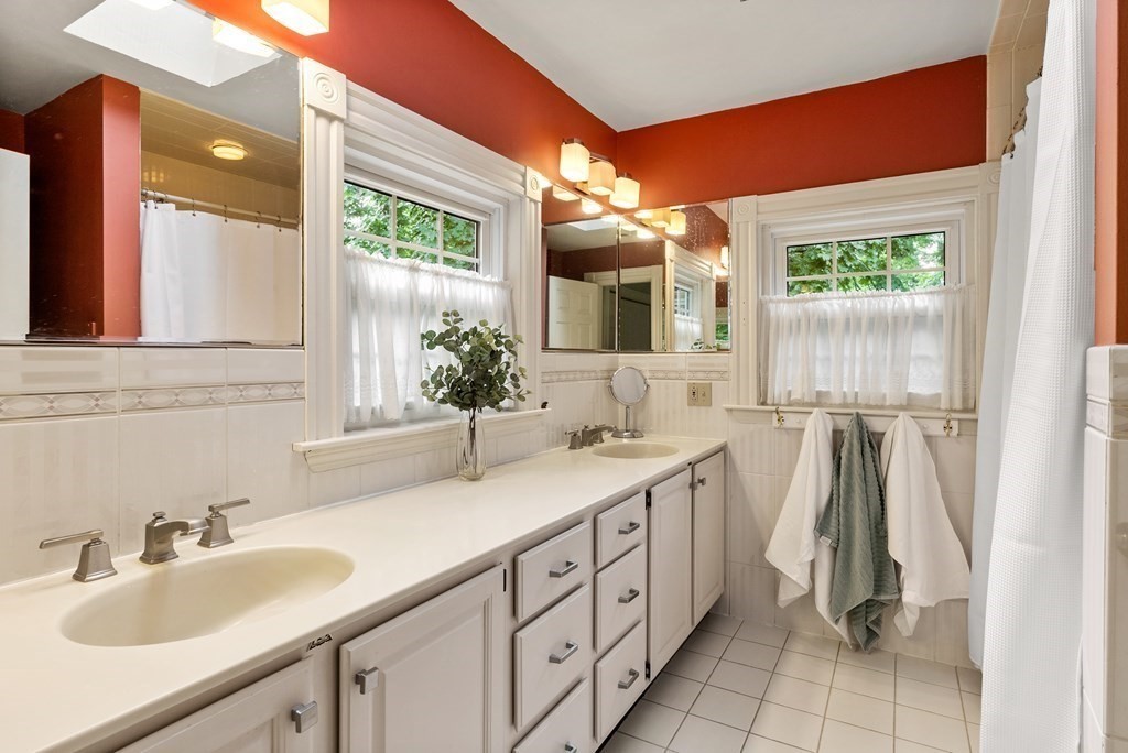 126 Chapman Street Canton, MA 02021 - Photo 22 of 42 a bathroom with a sink and a mirror