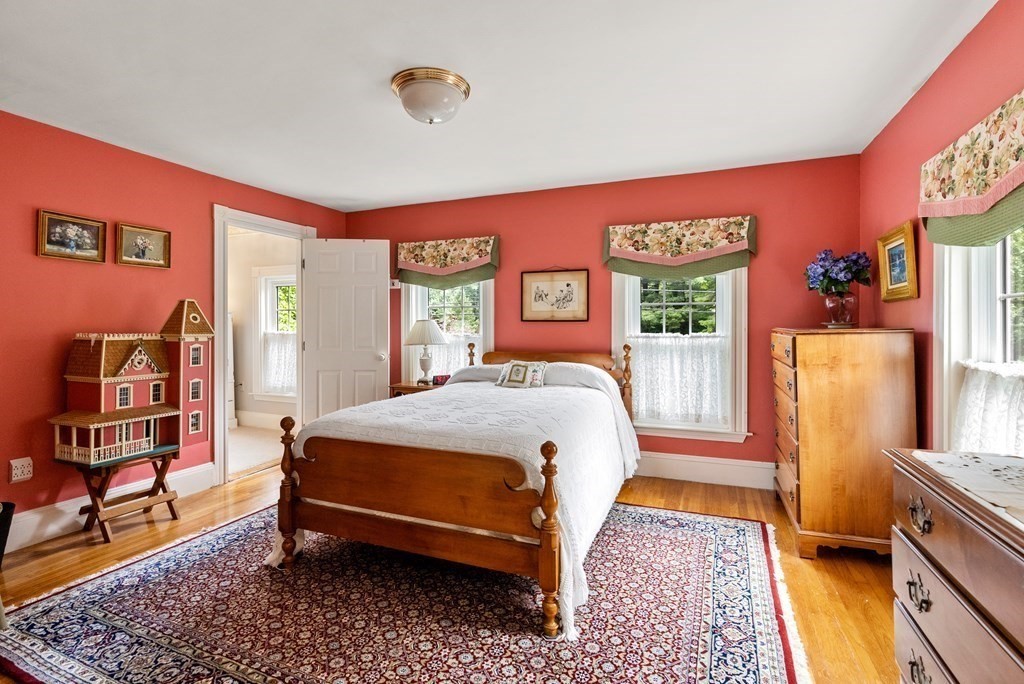 126 Chapman Street Canton, MA 02021 - Photo 24 of 42 a bed sitting in a bedroom next to a window