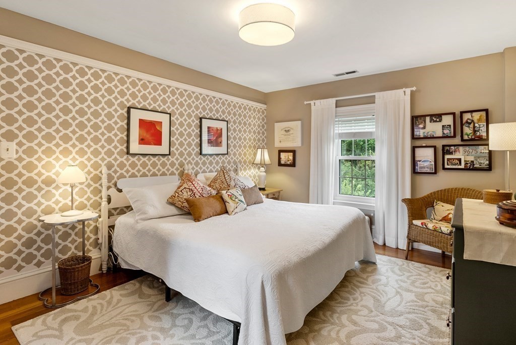 126 Chapman Street Canton, MA 02021 - Photo 27 of 42 a bedroom with a bed and wooden floor