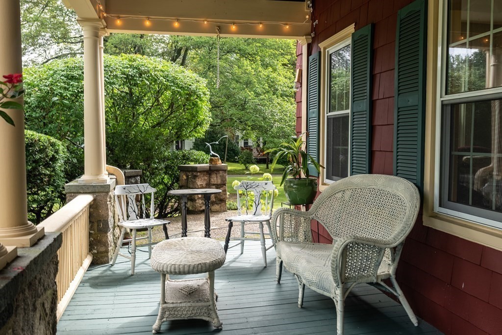 126 Chapman Street Canton, MA 02021 - Photo 3 of 42 a view of a chairs and table in the balcony