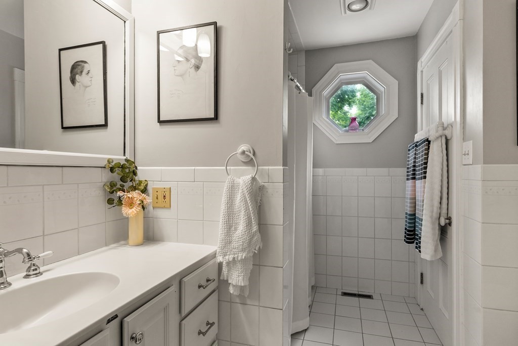 126 Chapman Street Canton, MA 02021 - Photo 32 of 42 a bathroom with a sink vanity and a mirror