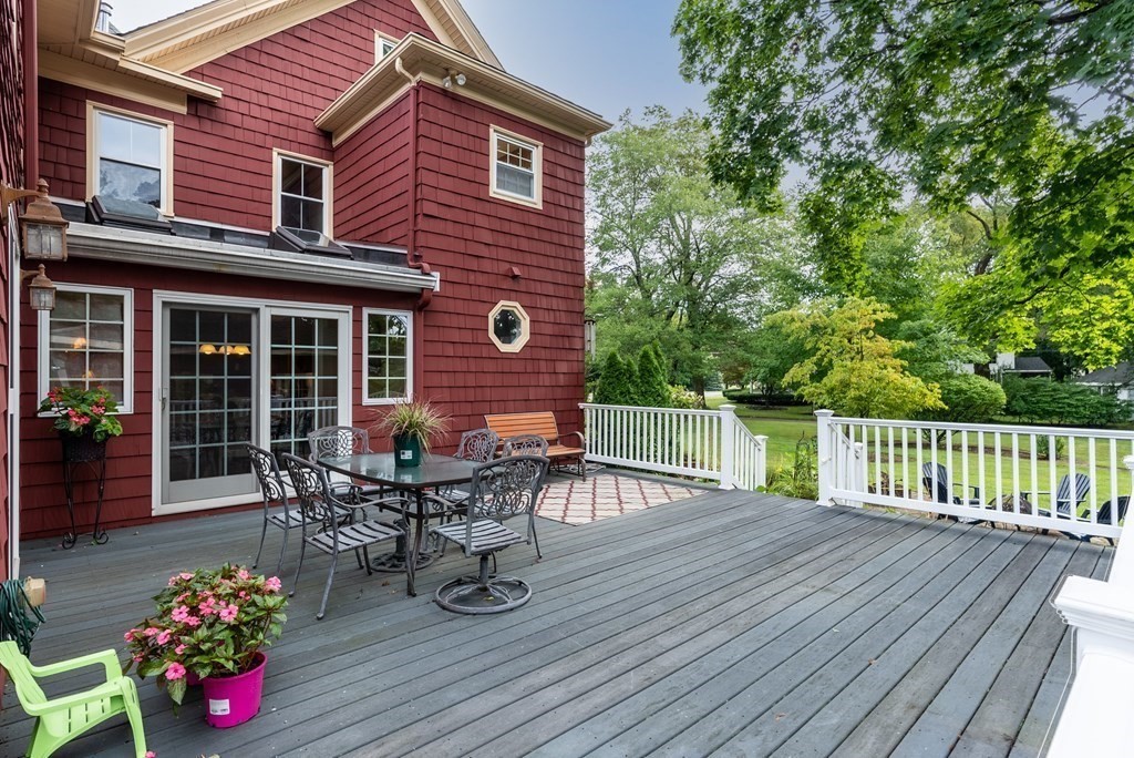 126 Chapman Street Canton, MA 02021 - Photo 36 of 42 a roof deck with table and chairs and wooden floor