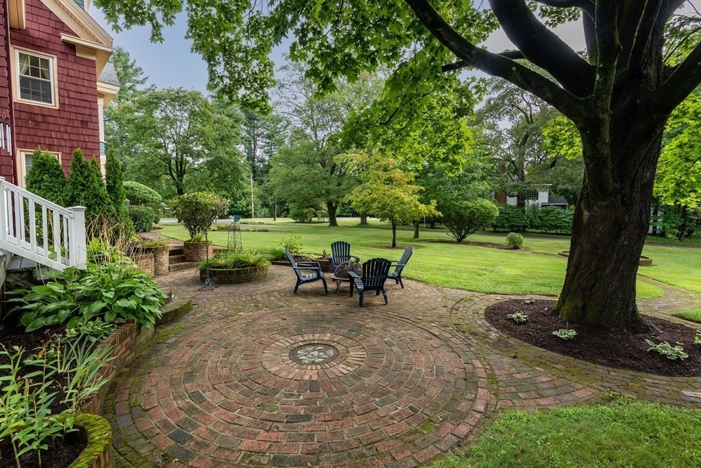 126 Chapman Street Canton, MA 02021 - Photo 38 of 42 a view of a two chair and table in the garden