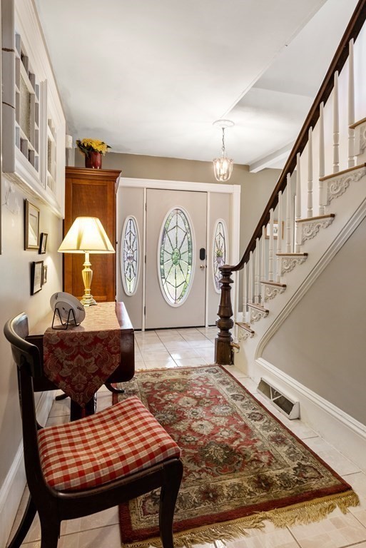 126 Chapman Street Canton, MA 02021 - Photo 5 of 42 a living room with furniture and a rug