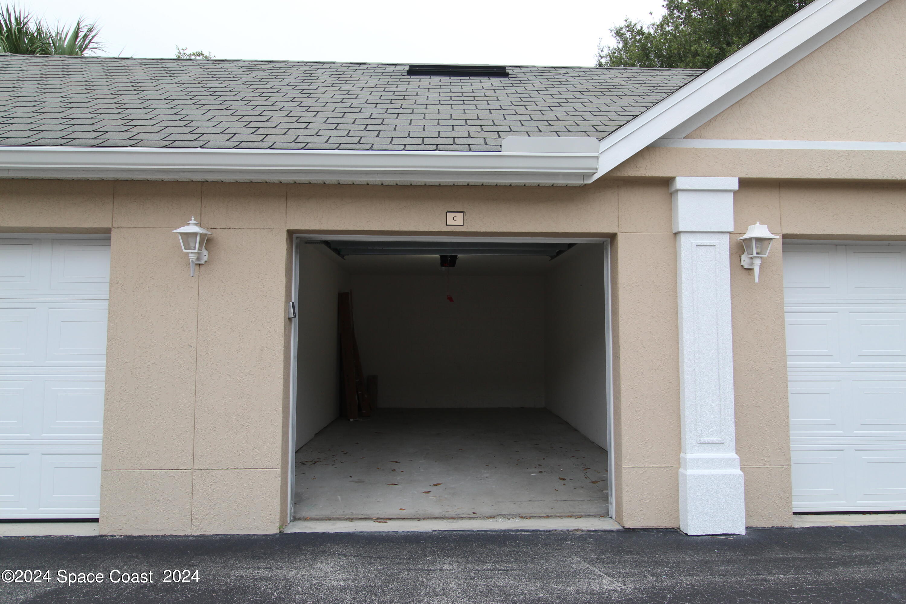 3975 Almeida Court, Unit 105 Melbourne, FL 32901 - Photo 13 of 18 a kitchen with a door