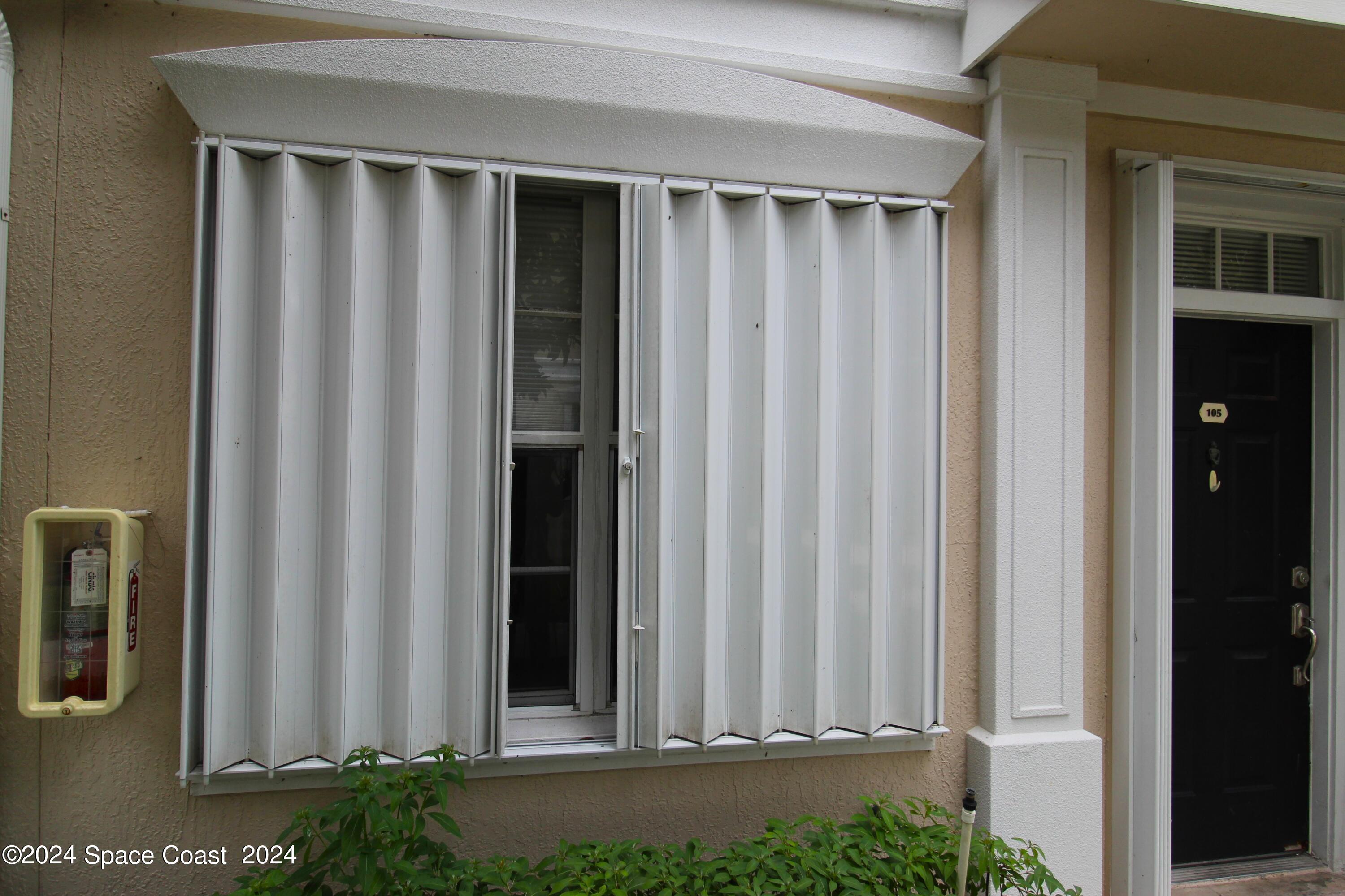 3975 Almeida Court, Unit 105 Melbourne, FL 32901 - Photo 15 of 18 a view of a porch with a yard