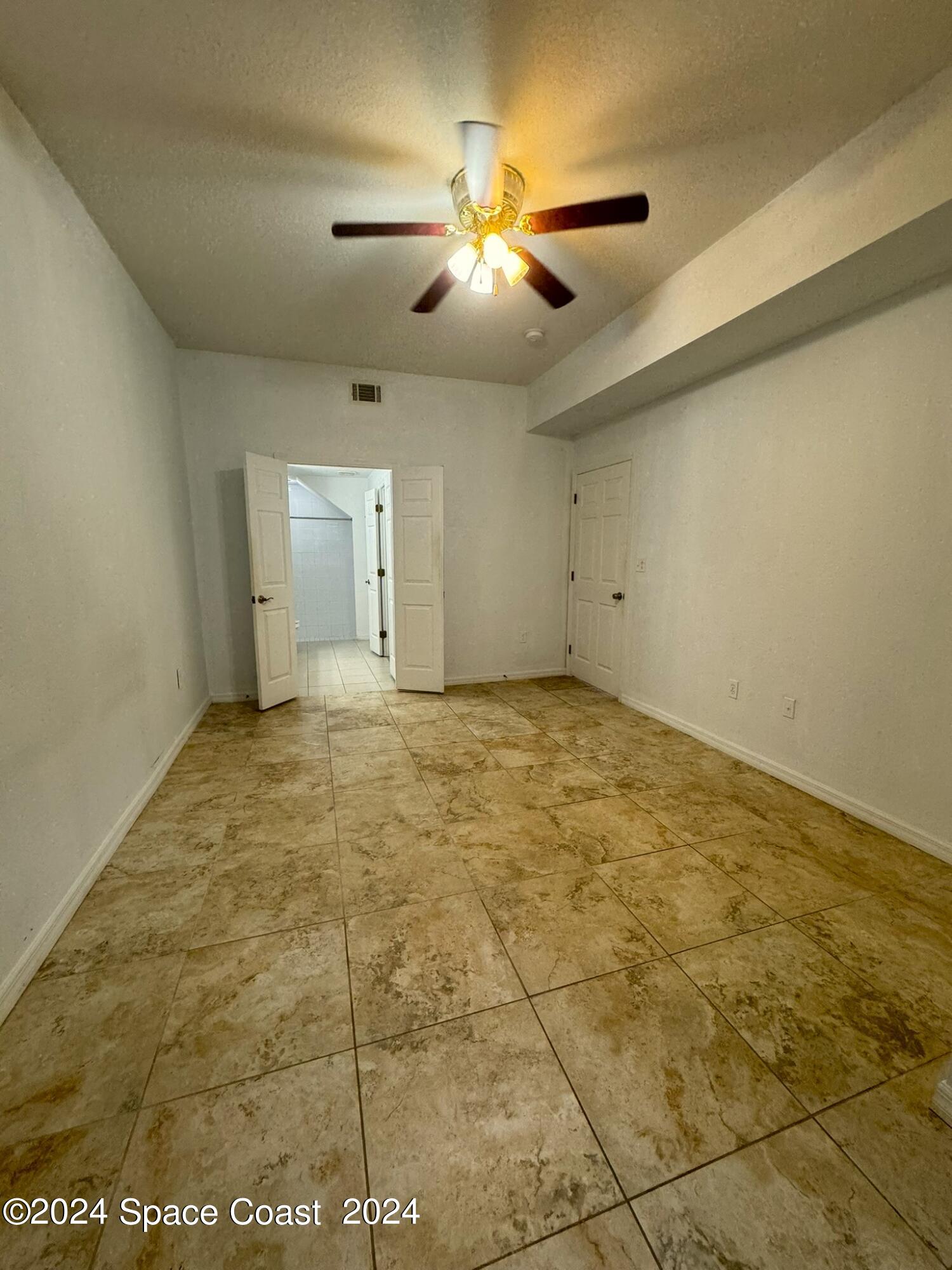 3975 Almeida Court, Unit 105 Melbourne, FL 32901 - Photo 5 of 18 a view of an empty room