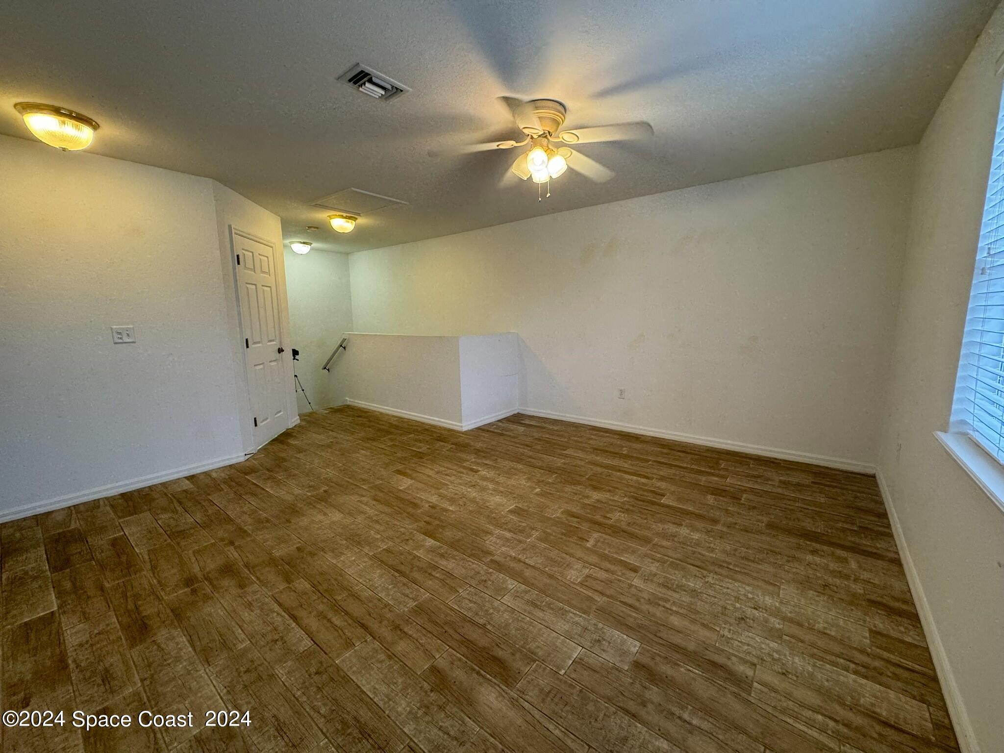 3975 Almeida Court, Unit 105 Melbourne, FL 32901 - Photo 9 of 18 a view of a room with an empty space