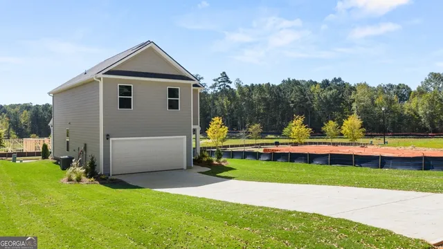 a view of a house with swimming pool and yard