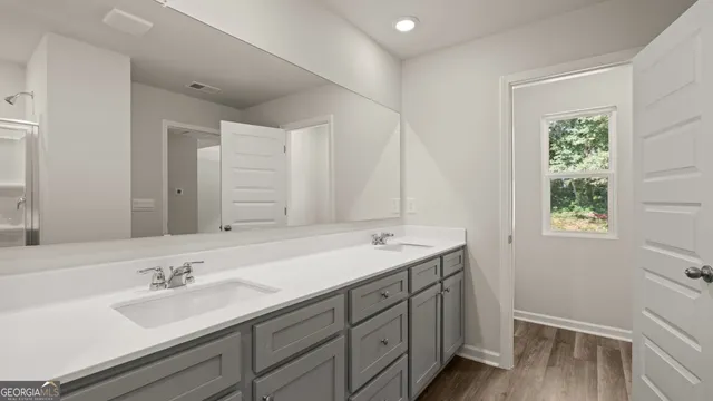 a bathroom with a glass shower door