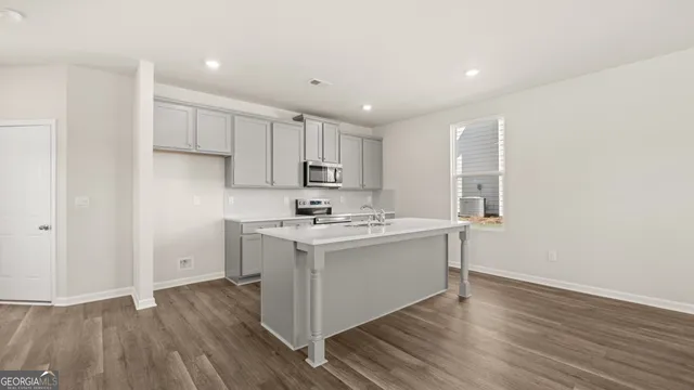a kitchen with a sink and cabinets