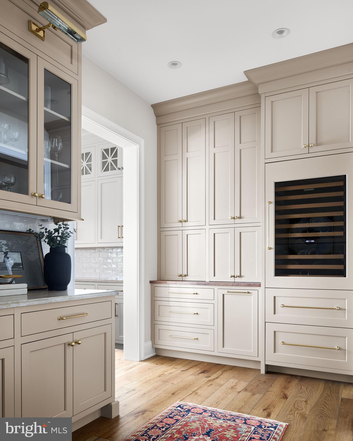 474 Barclay Road Bryn Mawr, PA 19010 - Photo 12 of 15 a kitchen with white cabinets and appliances