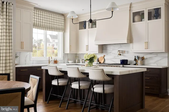 a kitchen with a table chairs stove and cabinets